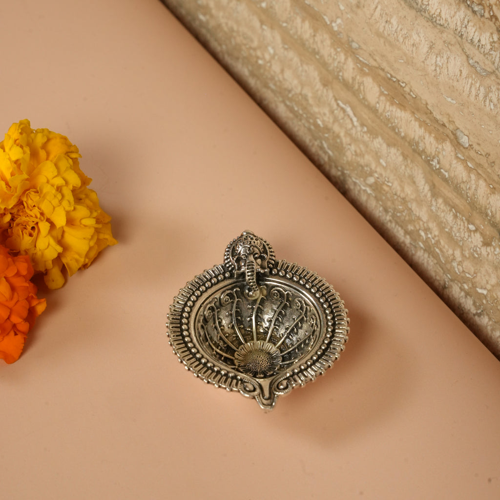 Diya with Lord ganesha symbol